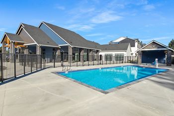 Heated pool with covered pool deck and outdoor entertainment system